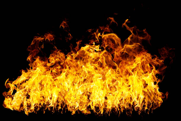 istock real firewalls and hot flames are burning on a black background. 1389851821