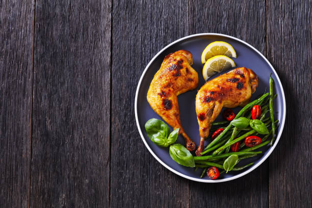istock juicy roast chicken legs with green beans salad 1389855362