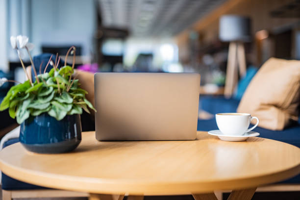 istock Laptop and coffee cup on the table 1389855827