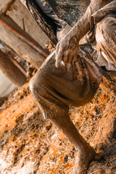 old labor worker is tired after hard work he is smoking