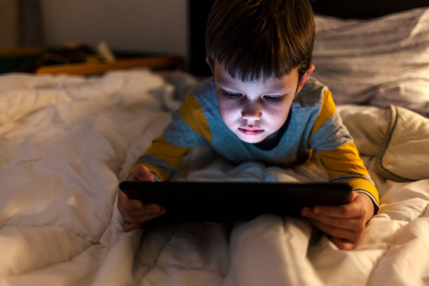 istock Love to play with daddy's tablet! 1389857848