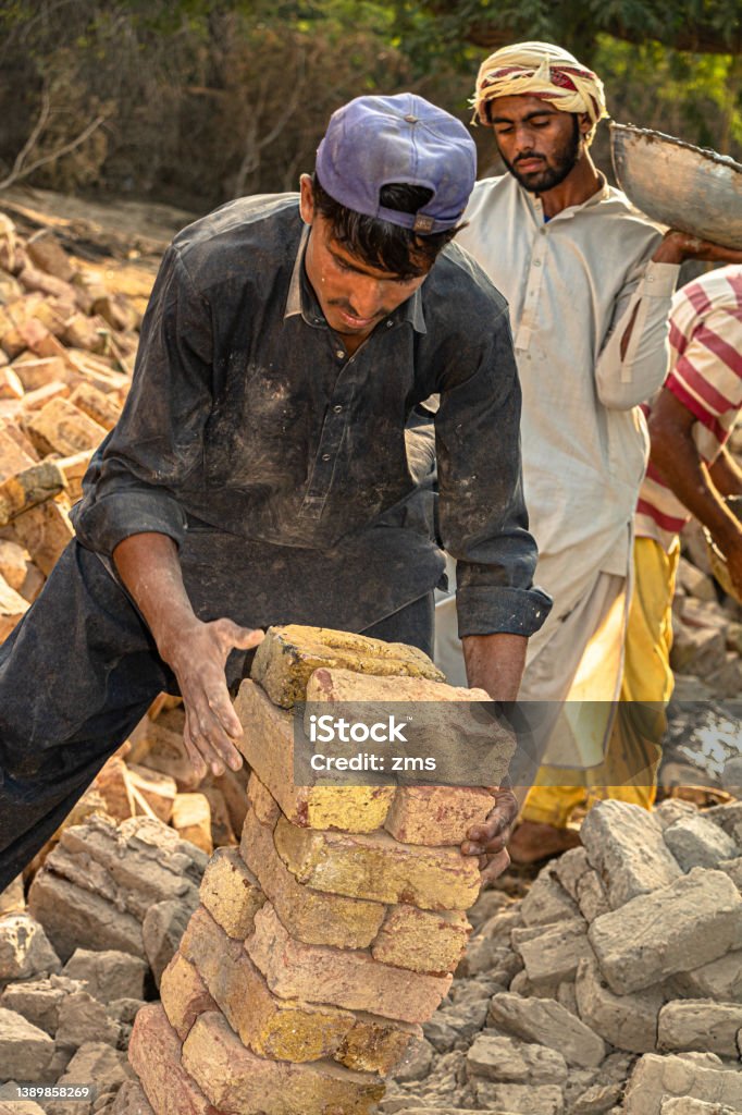Stock Photo Laborers Laborers Working On Underconstruction Site Stock Photo - Download Image ...
