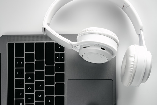 Computers and headphones on a white background