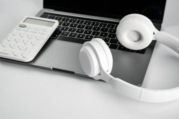 istock Computers, headphones and calculators on a white background 1389859622