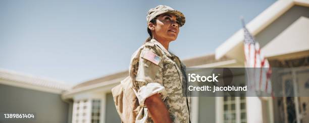 Courageous Female Soldier Returning Home From The Army Stock Photo - Download Image Now