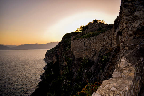 istock the sun sets over the sea behind the mountains 1389861999