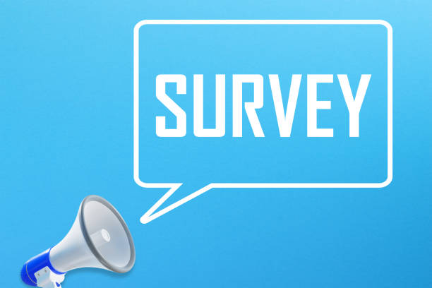 istock Survey message in speech bubble and megaphone on blue background 1389862484
