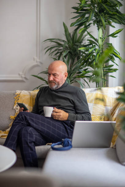 istock Caucasian senior man using mobile phone 1389862543