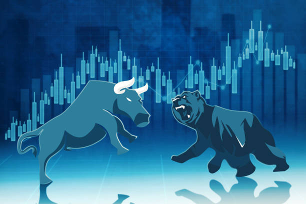 istock Bull and bear fighting near candlesticks chart 1389866150