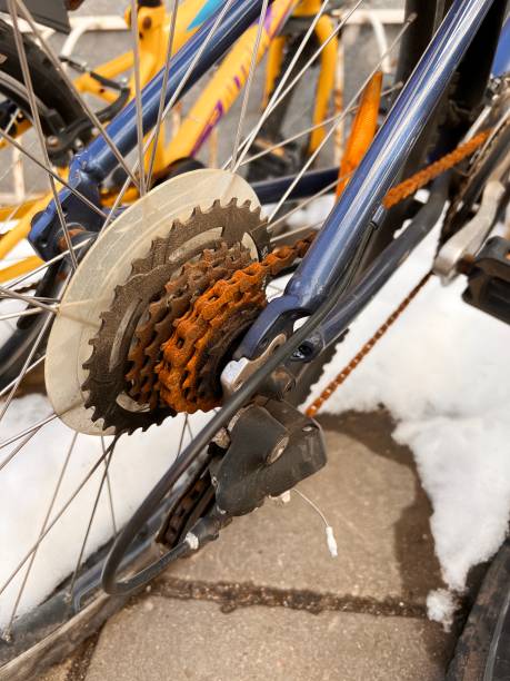 istock Blue bike has been outside all winter and got broken. Rusty bicycle chain hangs on sprocket and gear. 1389866528