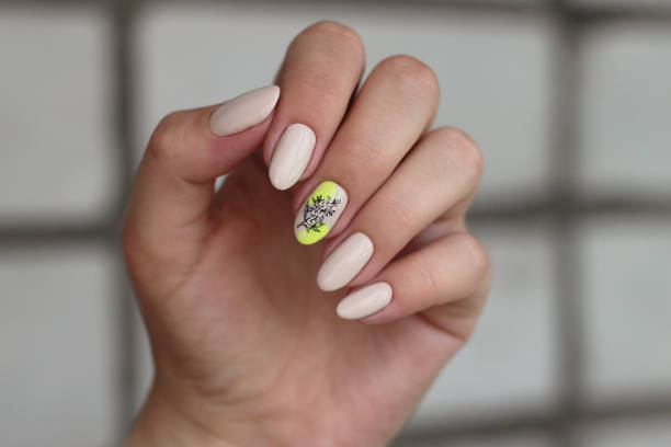 istock bright neon yellow manicure with a pattern close-up 1389867534