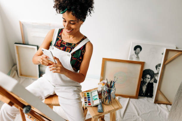 Vlogger capturing her artwork with a smartphone