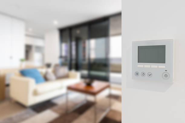 istock Home security video doorbell with temperature controller and indoor blur background 1389869366