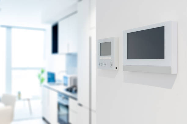 istock Home security video doorbell with temperature controller and indoor blur background 1389869402