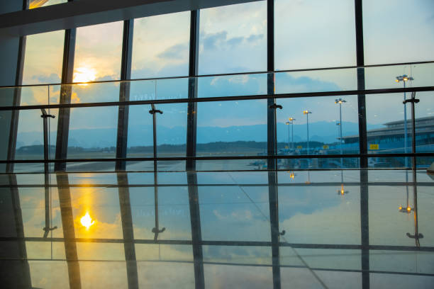 istock Airport window at sunset 1389870909