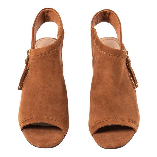 istock Brown suede shoes on white 1389872817