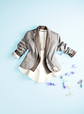 Fashionable jacket isolated on blue background (with clipping path)