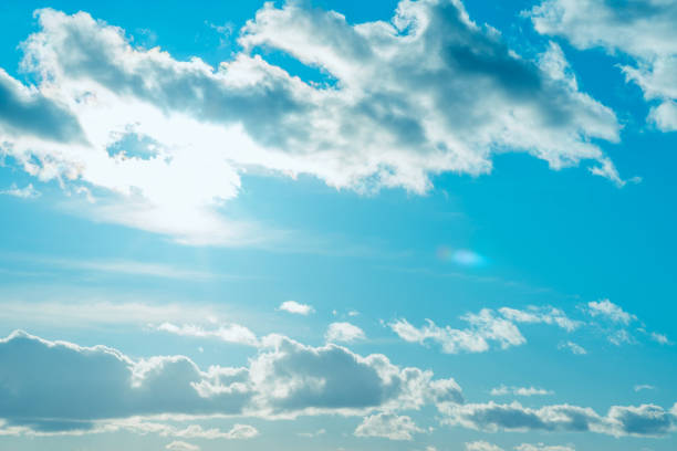 Beautiful sunset cloudy blue sky evening.Landscape,sun sunrays through the white clouds.