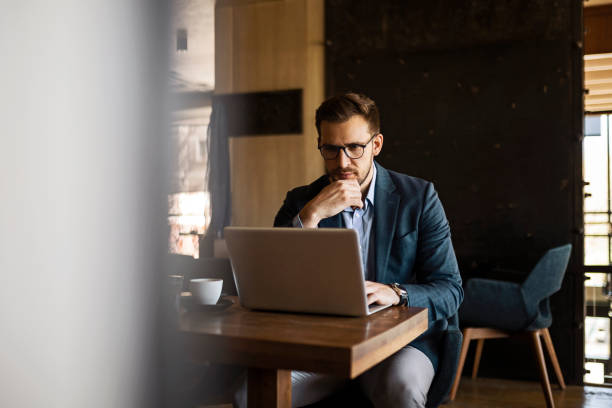 istock Businessman working on laptop 1389875279