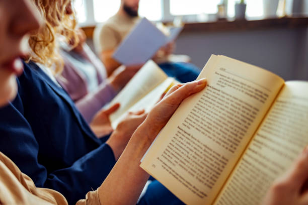istock Group of students reading books 1389876277
