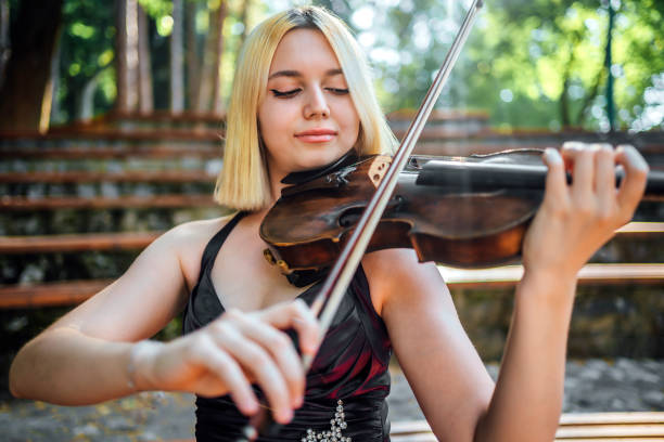 istock Woman musician with her violin 1389876359