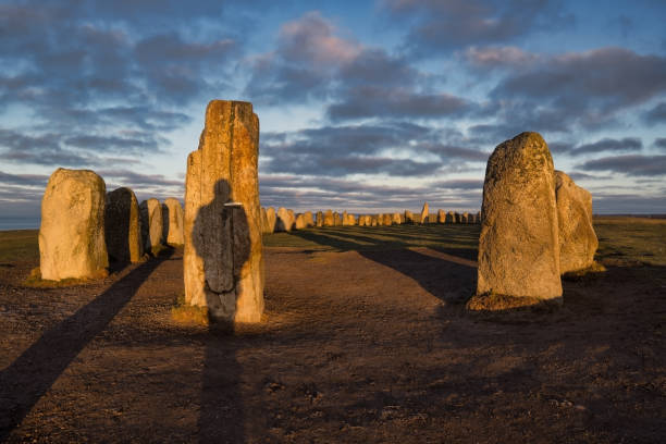 Historical site in Sweden Ales Stenar Ales stenar megalithic monument near Ystad in southern Sweden, early dawn, amazing light ales stenar stock pictures, royalty-free photos & images