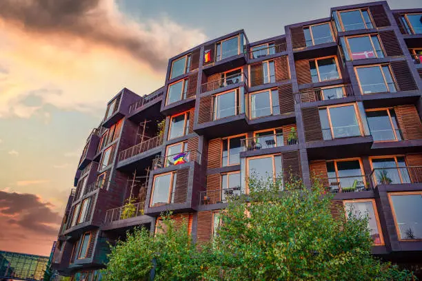 Photo of student residence building Tietgen Student Hall Tietgenkollegiet with LGBT flags in the windows in Copenhagen, Denmark