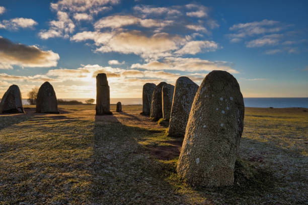 Historical and archaeological site in Sweden Ales Stenar Ales stenar megalithic monument near Ystad in southern Sweden, shadow of the biggest stone megalith stock pictures, royalty-free photos & images