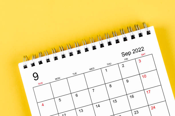 istock September 2022 desk calendar on yellow background. 1389882919