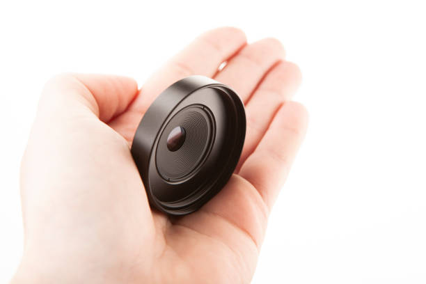 image of photo lens hand white background