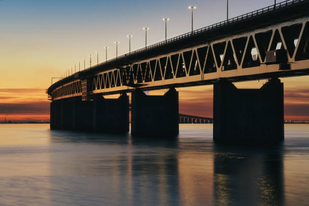 istock The Oresund Bridge between Denmark and Sweden at sunset 1389884313