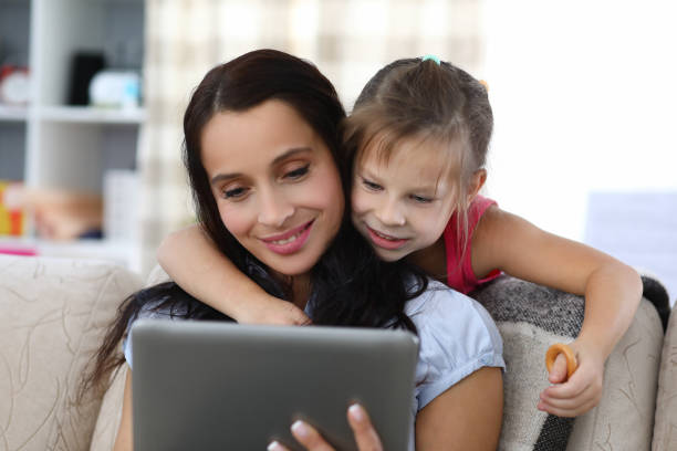 istock Relaxed smiling woman and happy child 1389885448