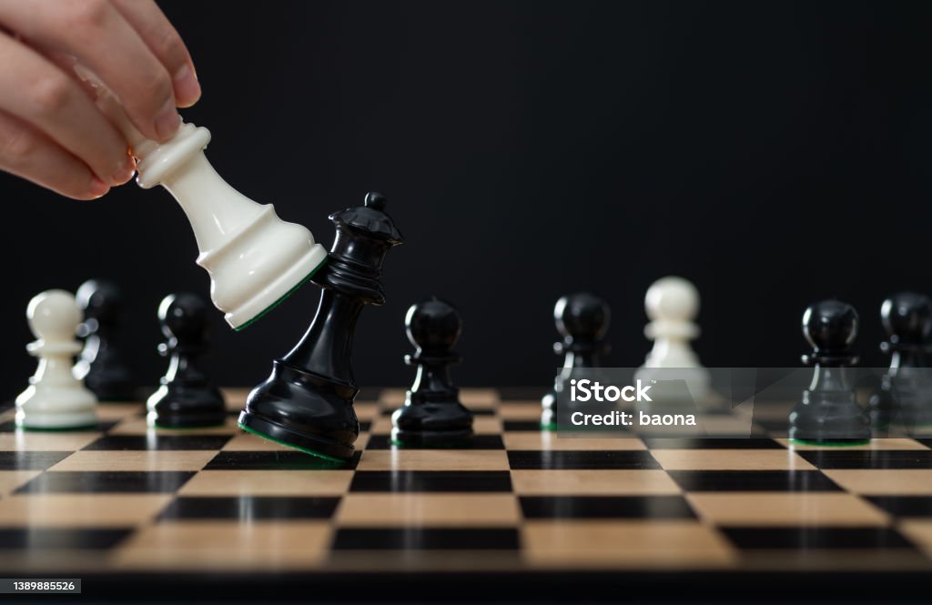 Black chess queen is falling Black chess queen is falling. Decisions Stock Photo