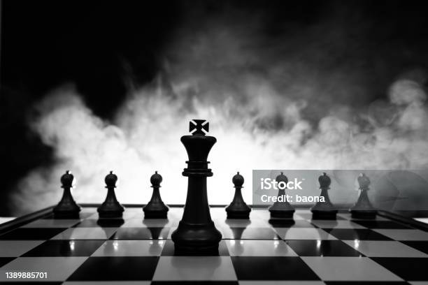 Chess King And Pawns On The Chess Board Stock Photo - Download Image Now - Domination, Chess, Chess Piece