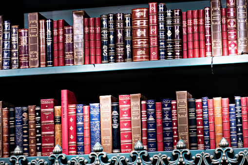 Old books on a shelf in a library