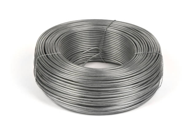 Coil of galvanized wires lying on white background. High resolution photo.