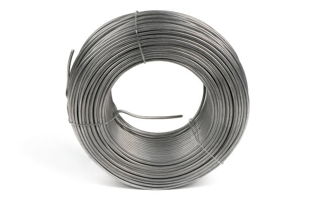 istock Coil of galvanized wires lying on white background. High resolution photo. 1389888629