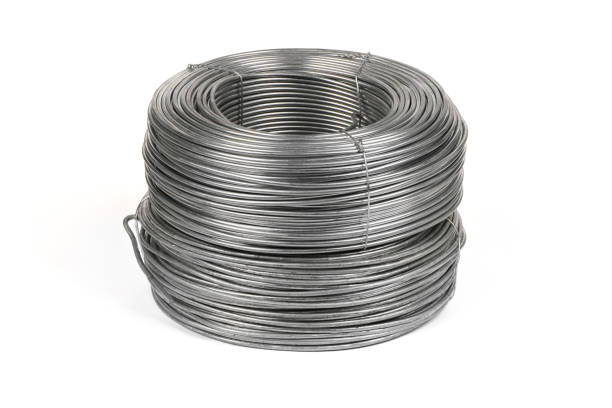 istock Two coils of galvanized wires lying on white background. 1389888702