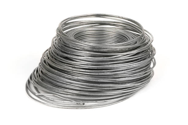 istock Coil of galvanized wires lying on white background. High resolution photo. 1389888776