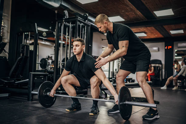 istock Man training with fitness trainer 1389888948