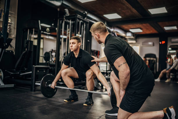 istock Man training with fitness trainer 1389888993