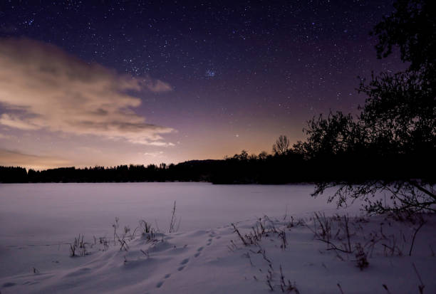 istock starry sky on a lonely lake in winter 1389889615