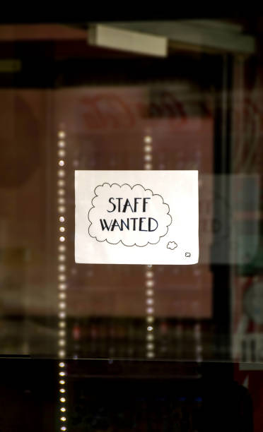 istock Handwritten job advert in a shop window 1389889754