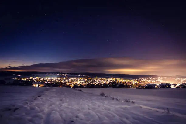 Scenic night winter city lights blue nightsky