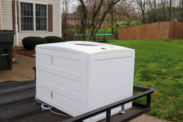 istock A broken washing machine sitting outside on a trailer 1389893778