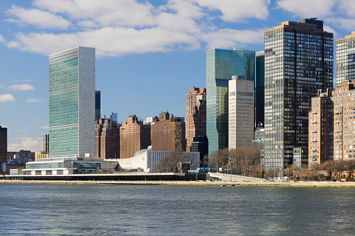Day time view of the skyline of Midtown Manhattan featuring the headquarters of the United Nations.