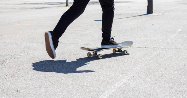 istock Close-up of legs propelling a skateboard 1389897989