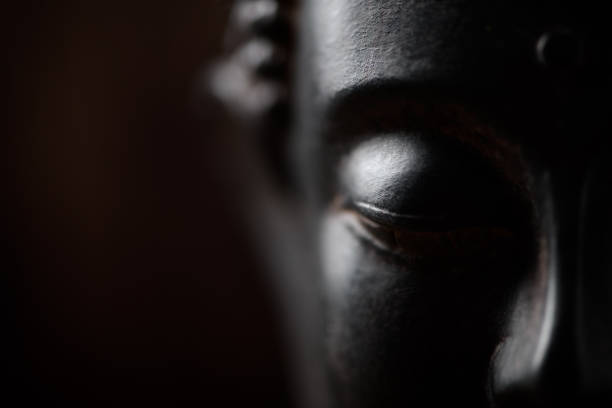 Portrays a detailed white plaster bust of an ancient figure set against a gradient orange background. Emphasizes historical artistry and the creative representation of classical art forms in modern works.