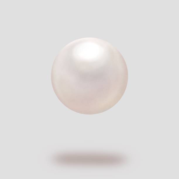 istock Pearls floating in the air on a gray background 1389899406