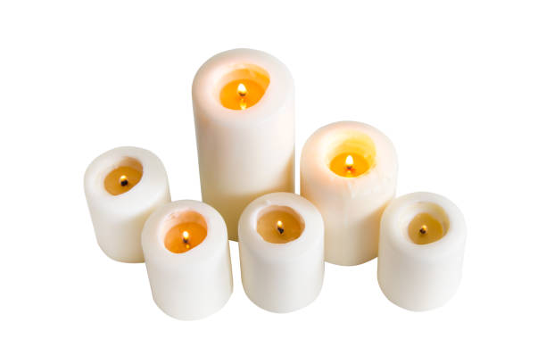 istock White candle isolated on a white background 1389899610